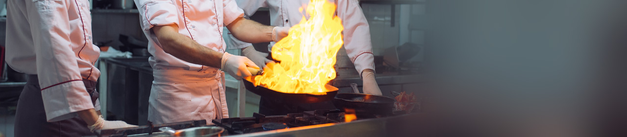 Flames arising from a cast iron pan in the kitchen