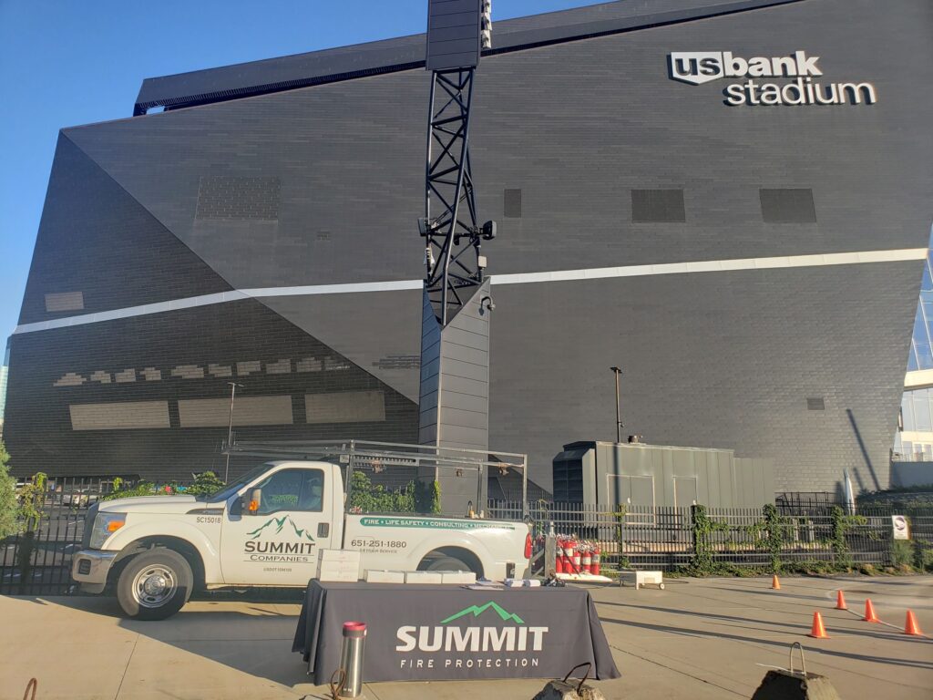 Summit Companies company pickup parked outside of the US Bank Stadium