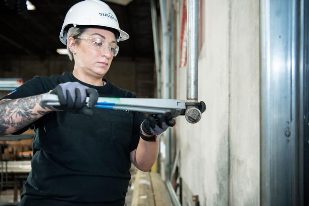 Person using a torque wrench.