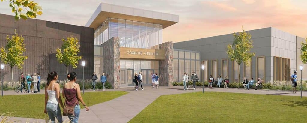 Modern campus center with students outside.