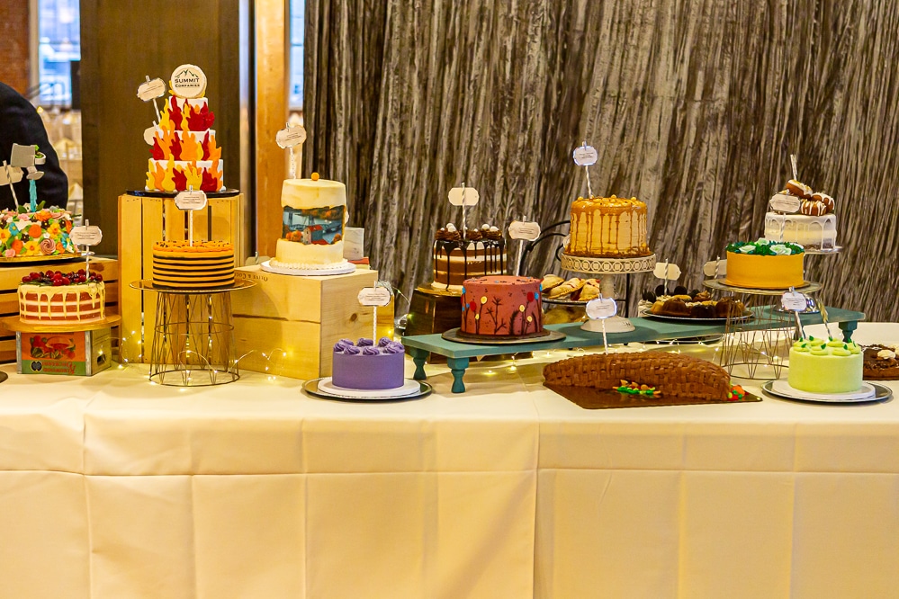 a variety of decorated cakes on a table