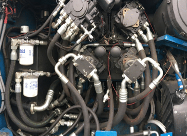 Complex machinery with hydraulic components.