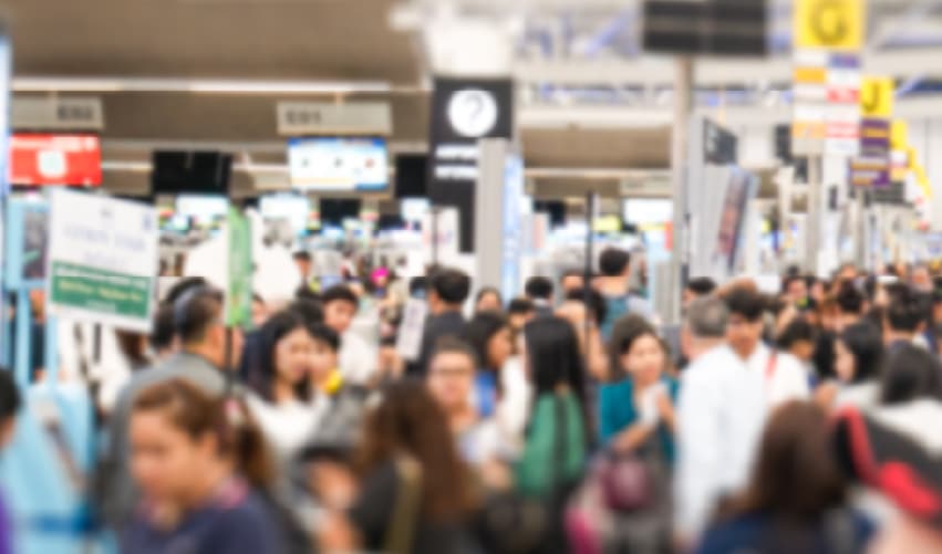 Crowded indoor space with many people.