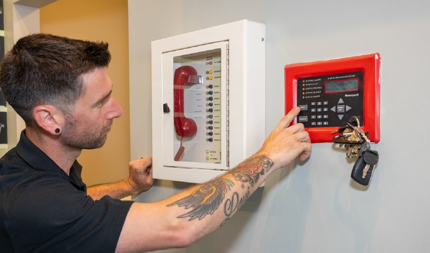 Fire alarm system installation in progress.