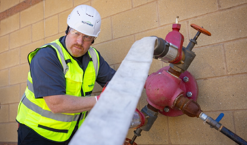 Person operating fire protection equipment.