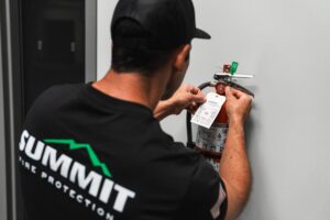 Technician Observing a Fire Extinguisher